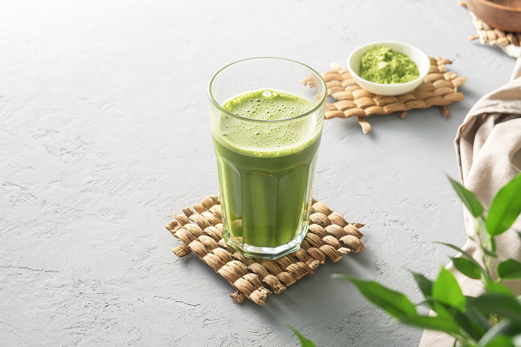 fresh matcha smoothie in a tall glass