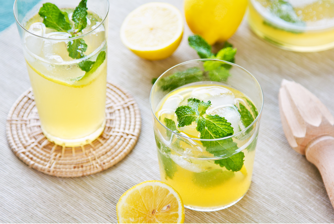 two lemonade a squeezer and lemons