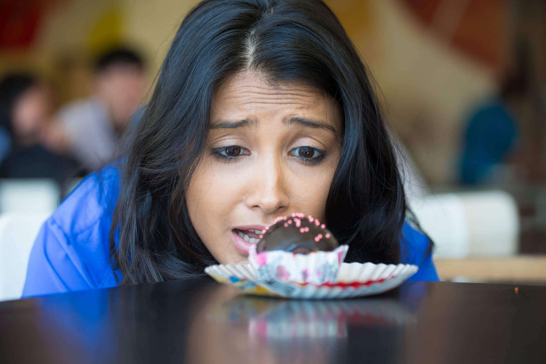 woman looking at a dessert