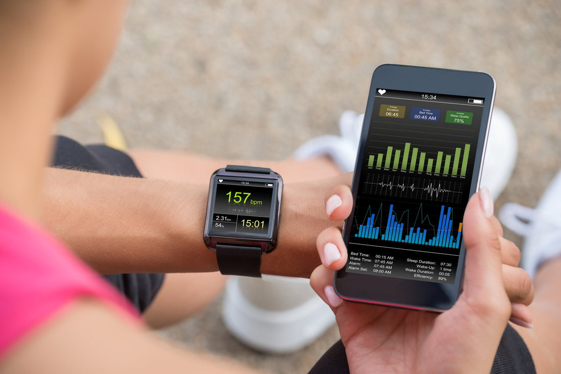 Woman wearing a fitness tracker and using a fitness app