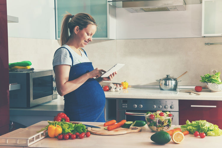 pregnant woman checking list of ingredients