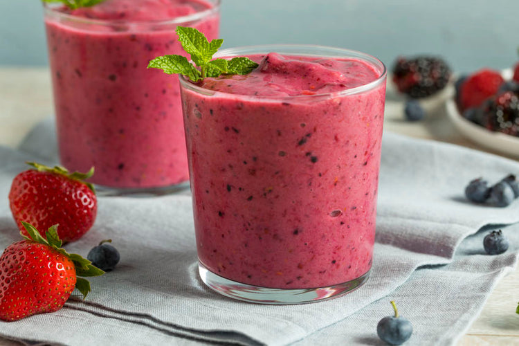 mixed berry smoothie in glasses on table