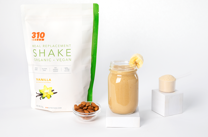 310 organic vanilla meal replacement and a smoothie again a white background