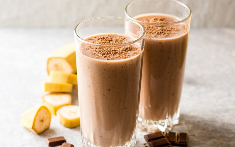 two glasses of chocolate banana cream pie smoothie