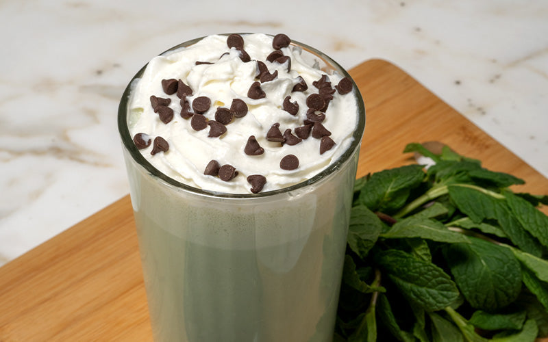 Cold Refreshing Mint Chocolate Chip MilkShake with a Straw