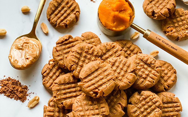 peanut butter pumpkin cookies with glass of milk