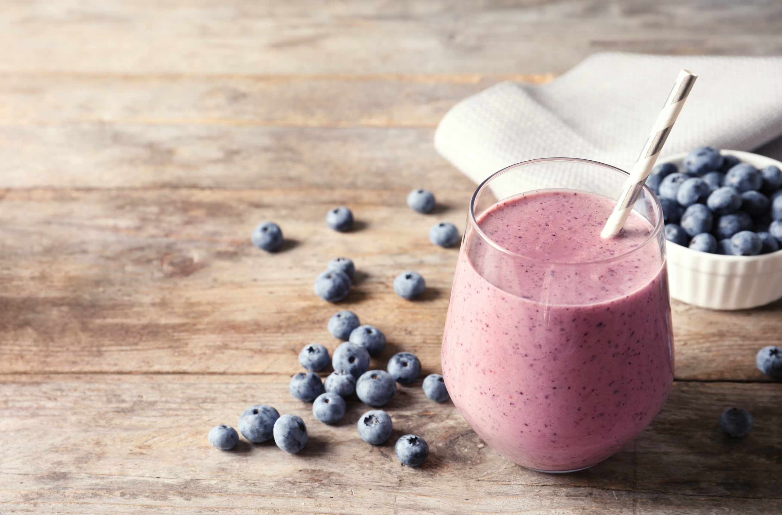 blueberry smoothie on wood background