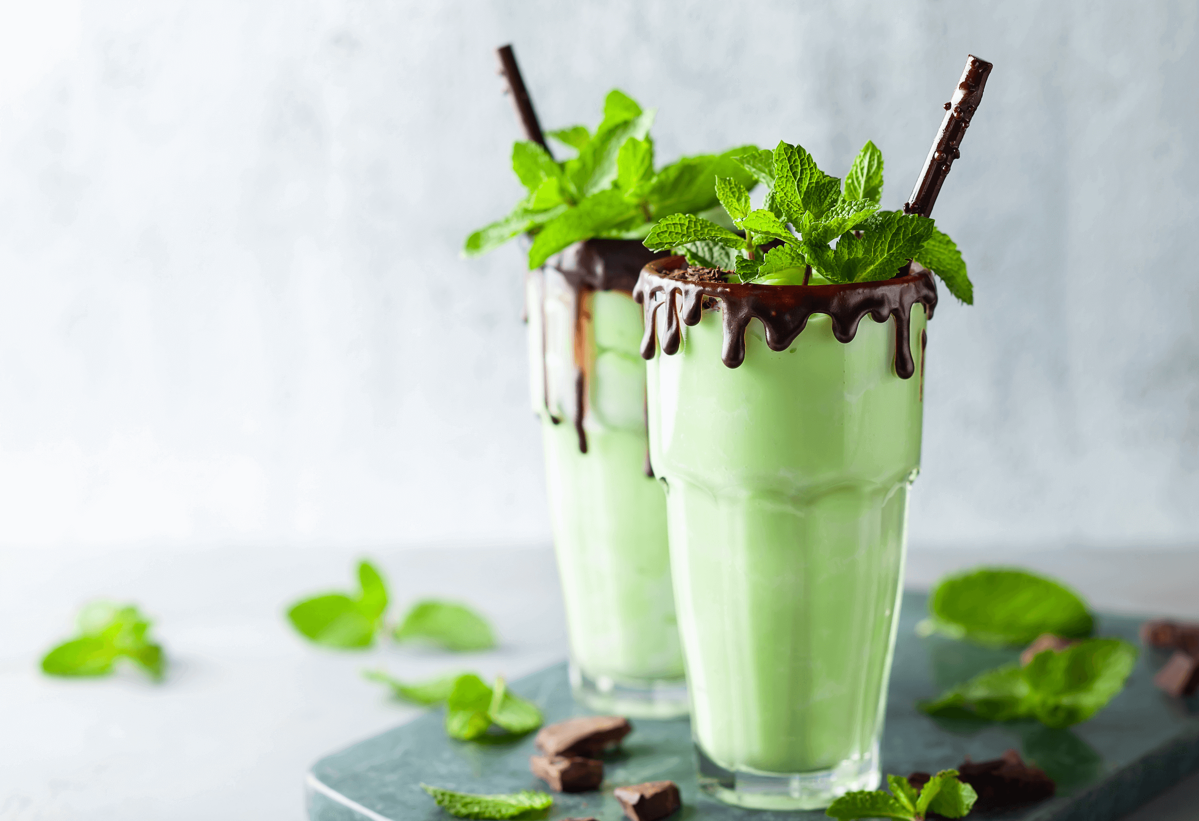 two thin mint keto shake garnished with mint leaves