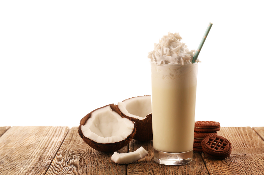 vanilla keto smoothie and coconut on a wooden table