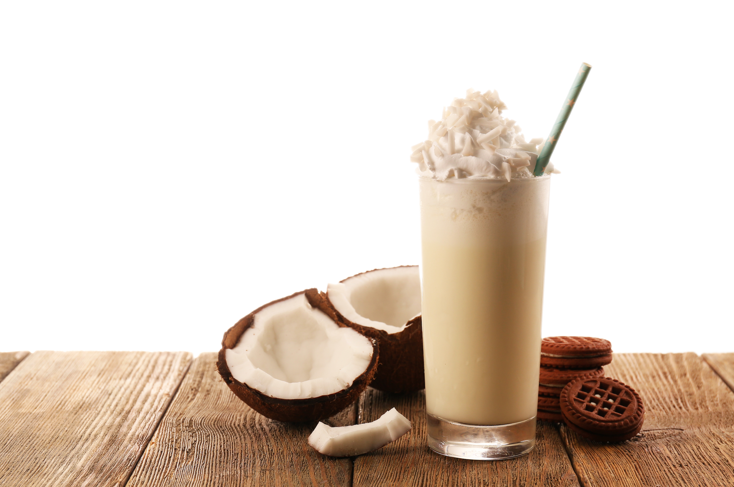 vanilla keto smoothie and coconut on a wooden table