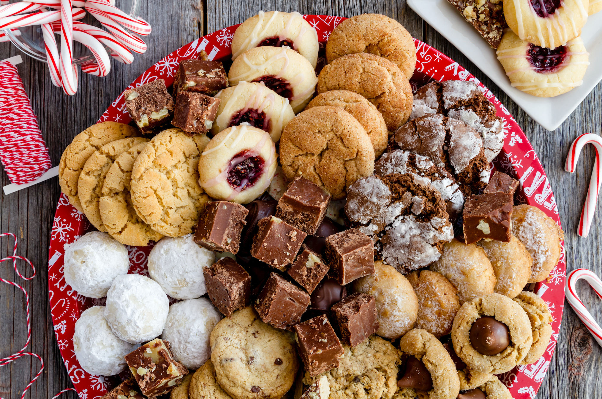 plate of christmas cookies with candy canes