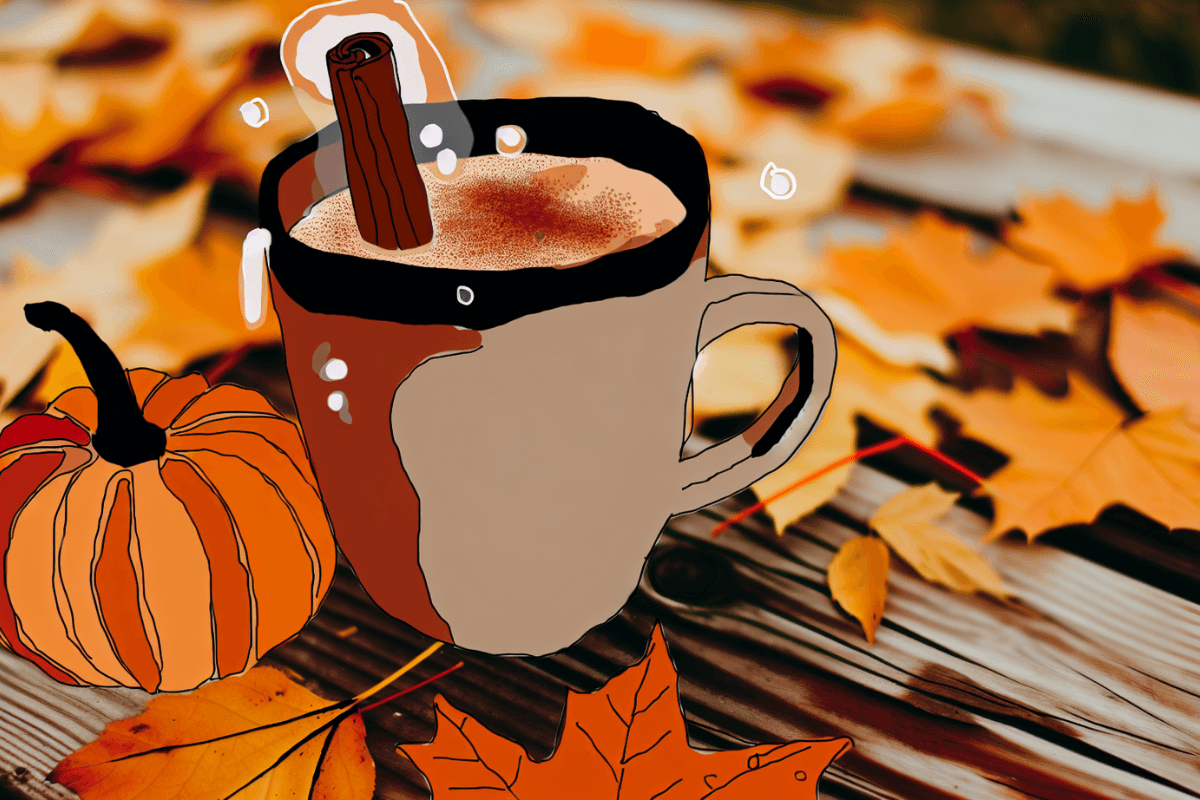 Fall-themed mug with cinnamon stick, pumpkin, and autumn leaves on a wooden table.