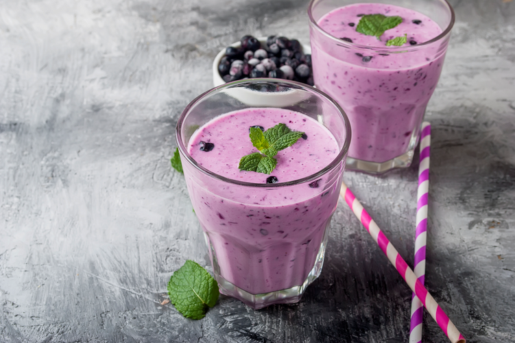 mixed berry shake with mint leaf and straws