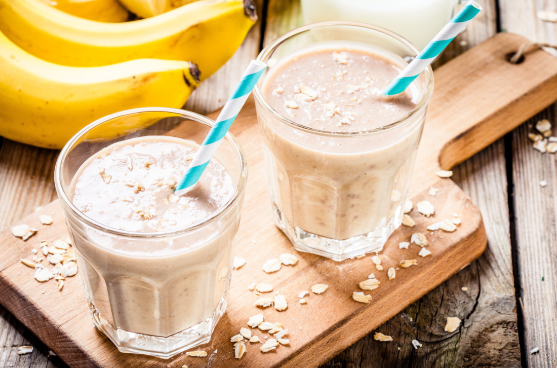 Healthy breakfast: banana smoothie with oatmeal, peanut butter and milk