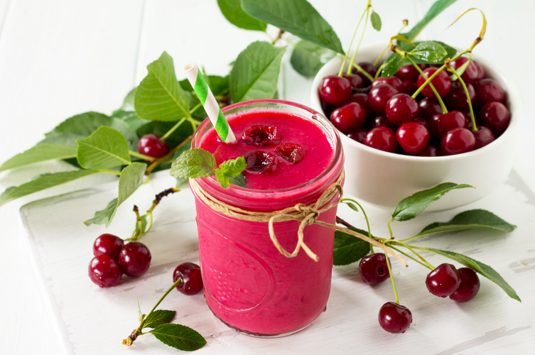 black berry hibiscus smoothie and a bowl of cherries 
