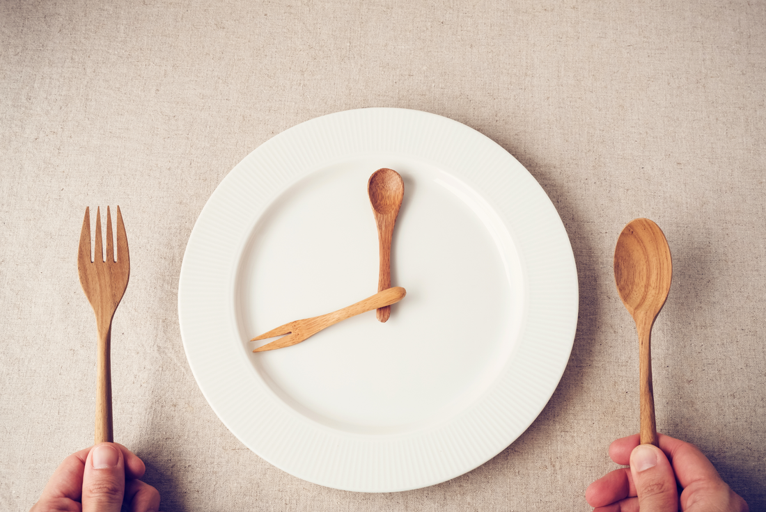 white plate with spoon and fork, Intermittent fasting concept, weight loss