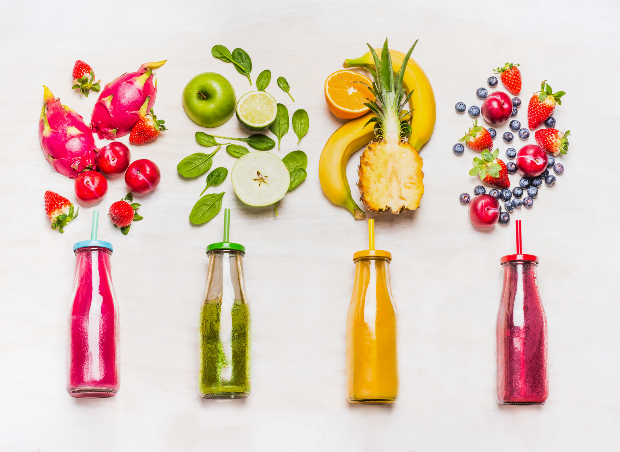 fruit smoothies in jars with fresh fruit