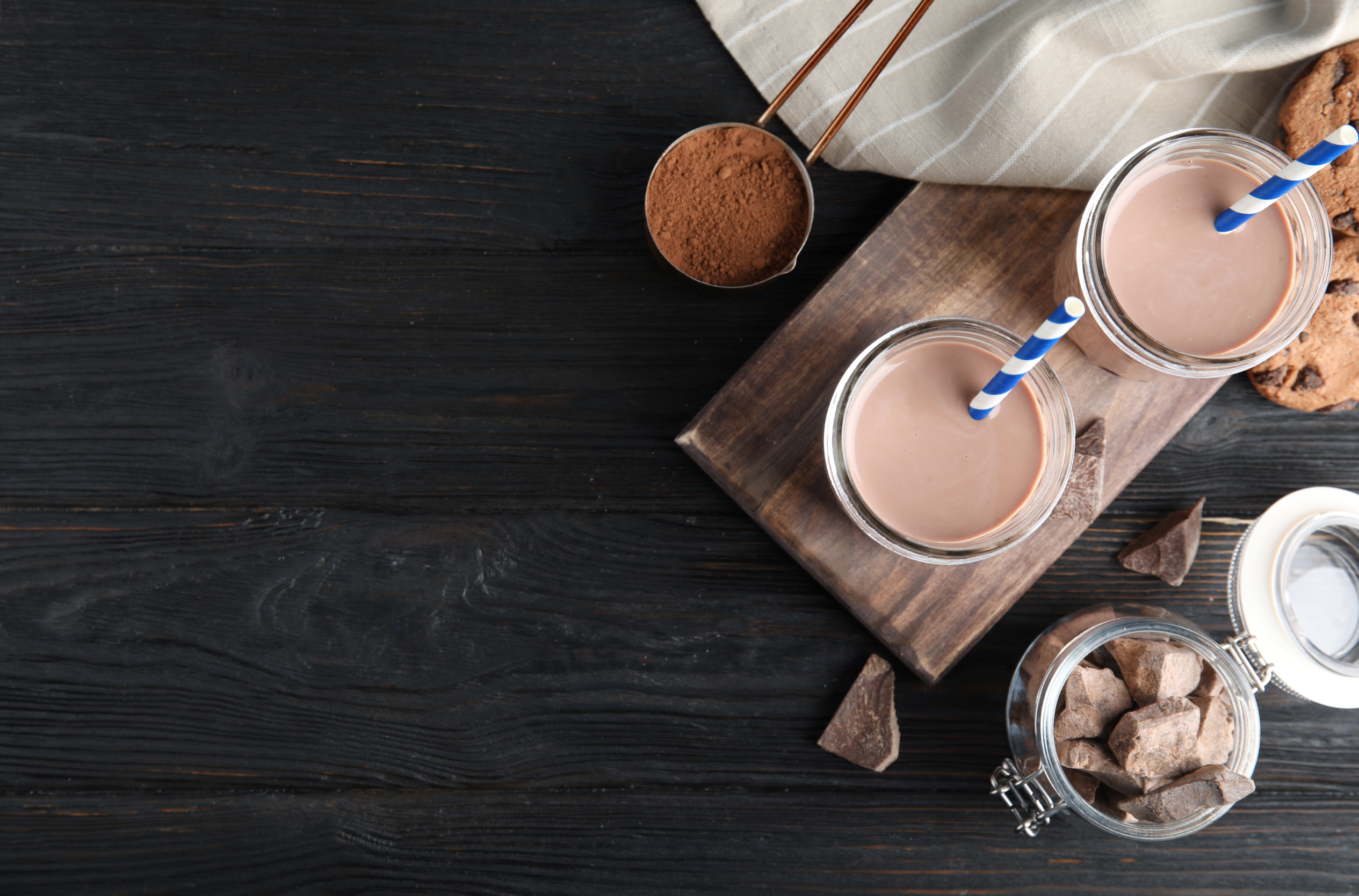 overhead view of chocolate cookie shake on a wooden surface
