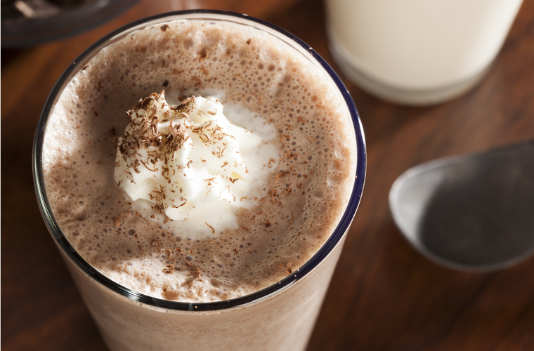 salted caramel chocolate milkshake with whipped cream on top