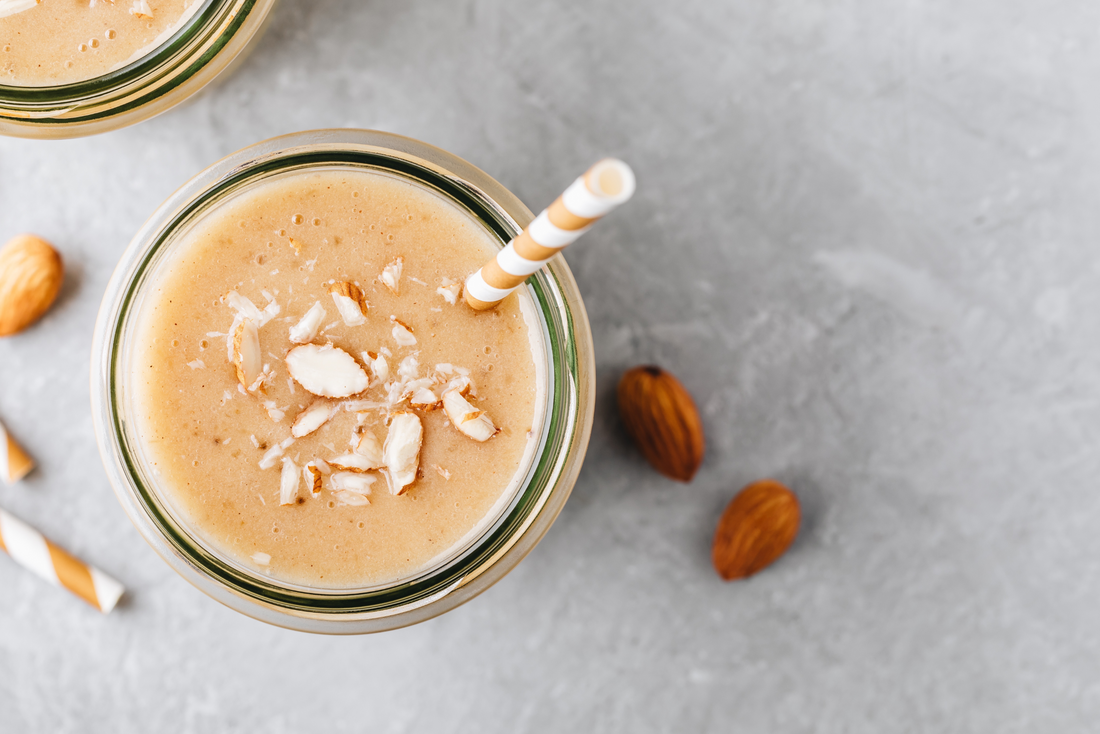 coconut cream smoothie topped with almonds 