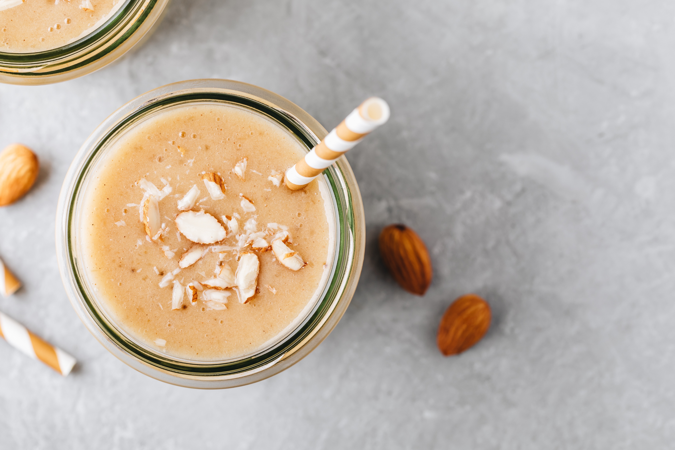coconut cream smoothie topped with almonds 