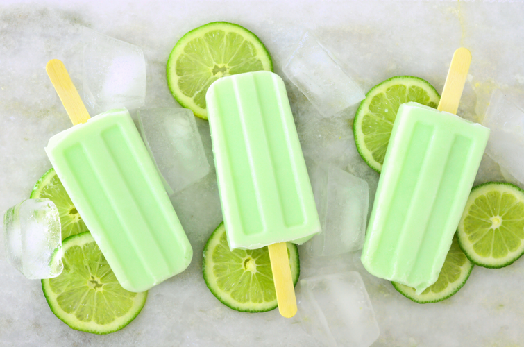 three lemon lime popsicle with ice and limes