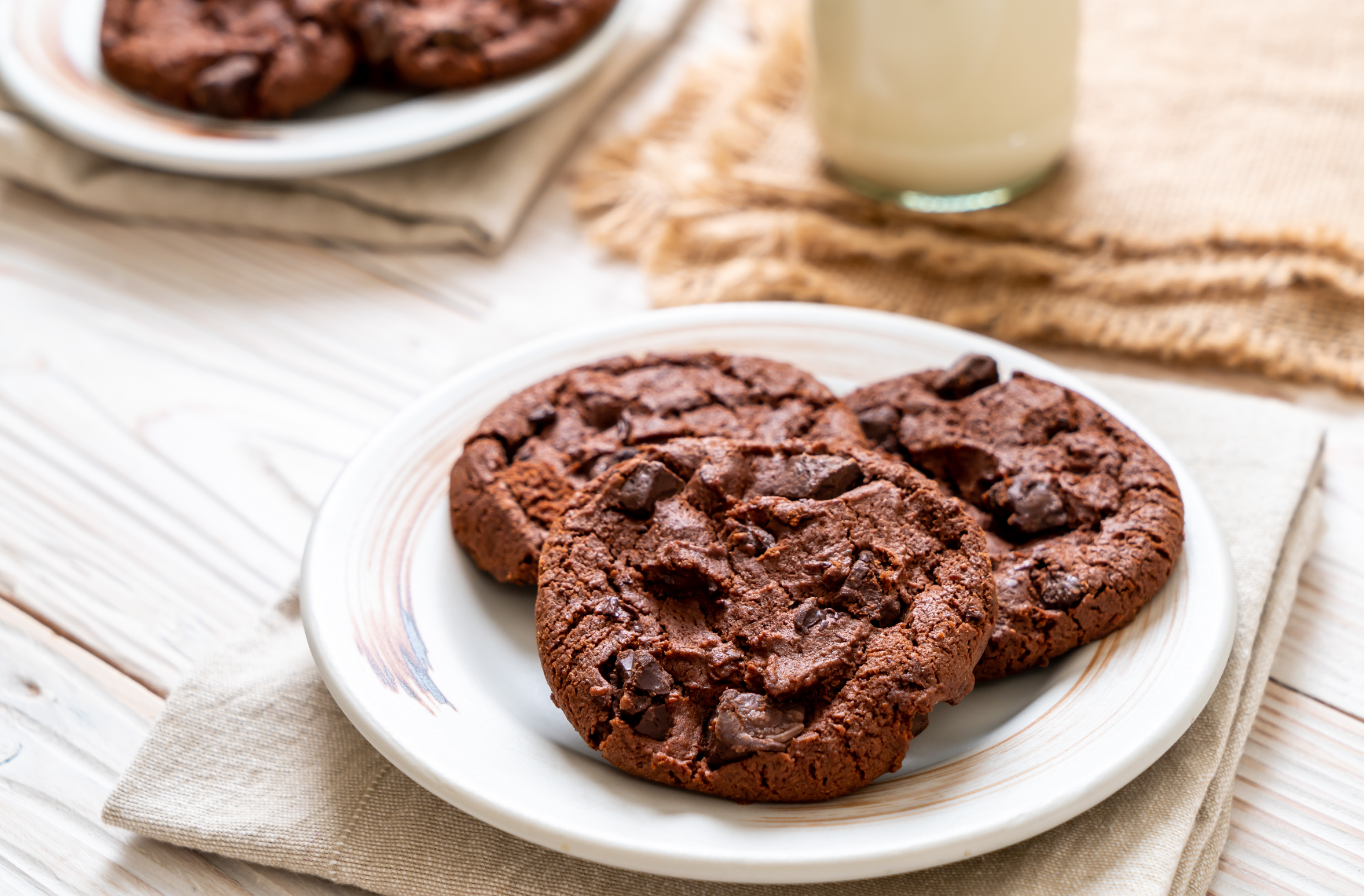 dark chocolate cookies with chocolate chips on a plate