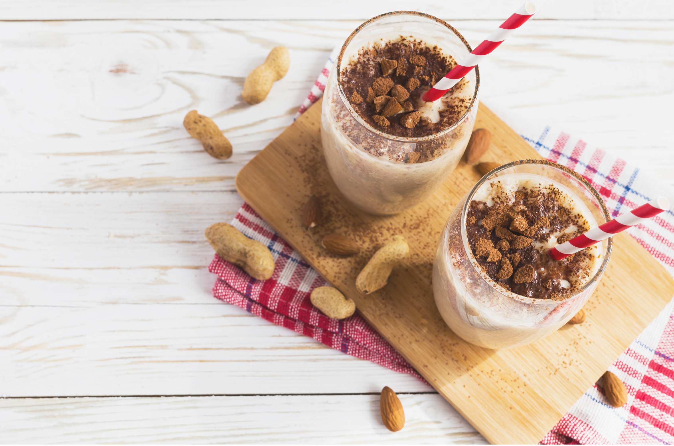 peanut butter smoothies in glass with cinnamon