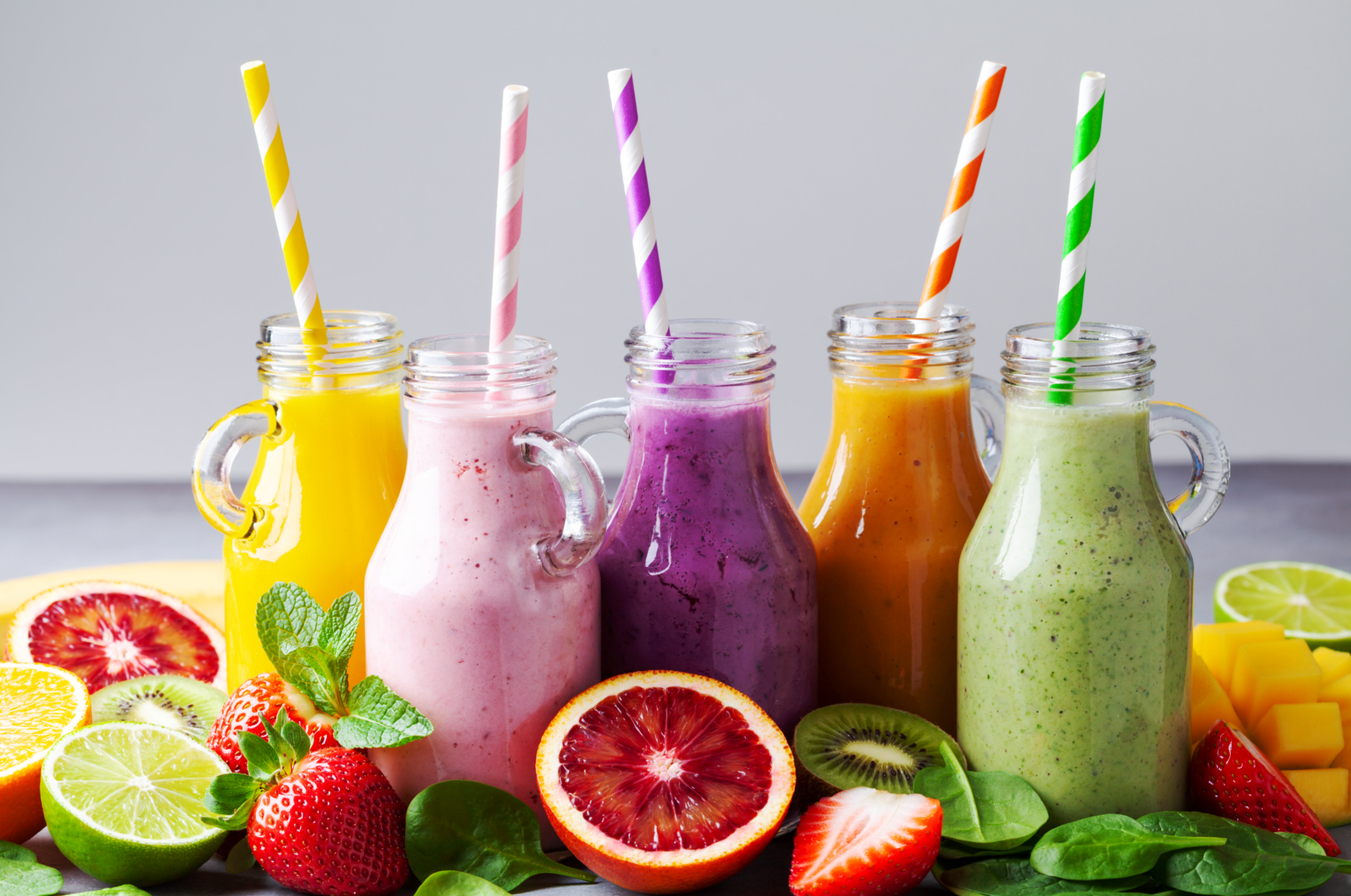 colorful smoothies and fresh fruits