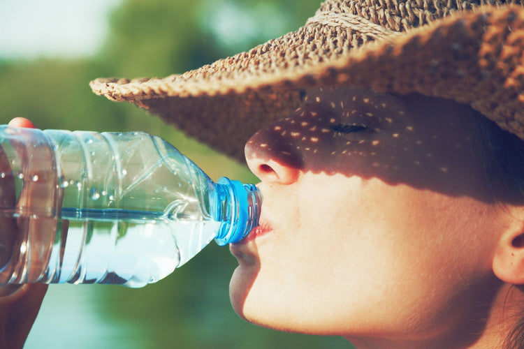 close up of a man drinking water