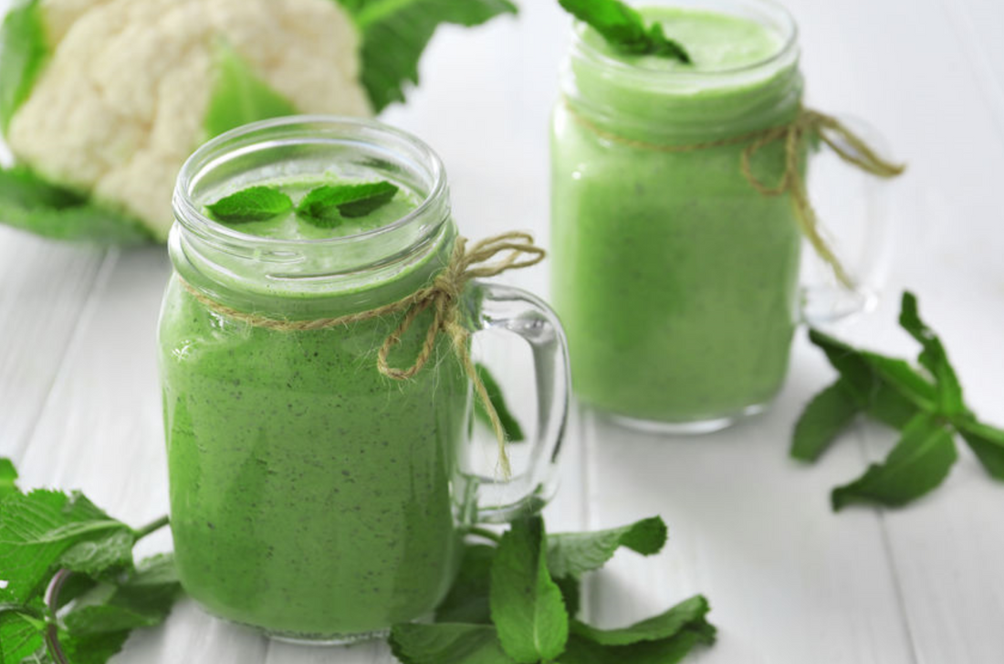 green smoothie with cauliflower and spinach in mason jars