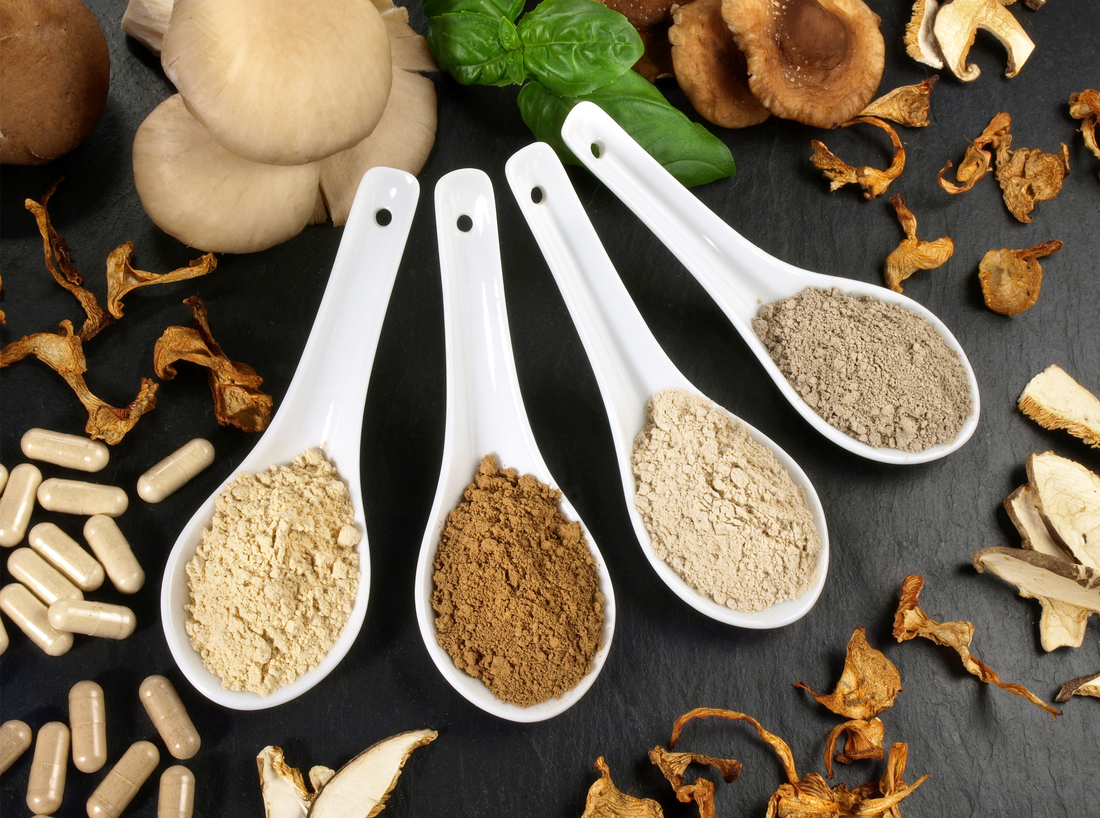 four measuring spoon filled with powder