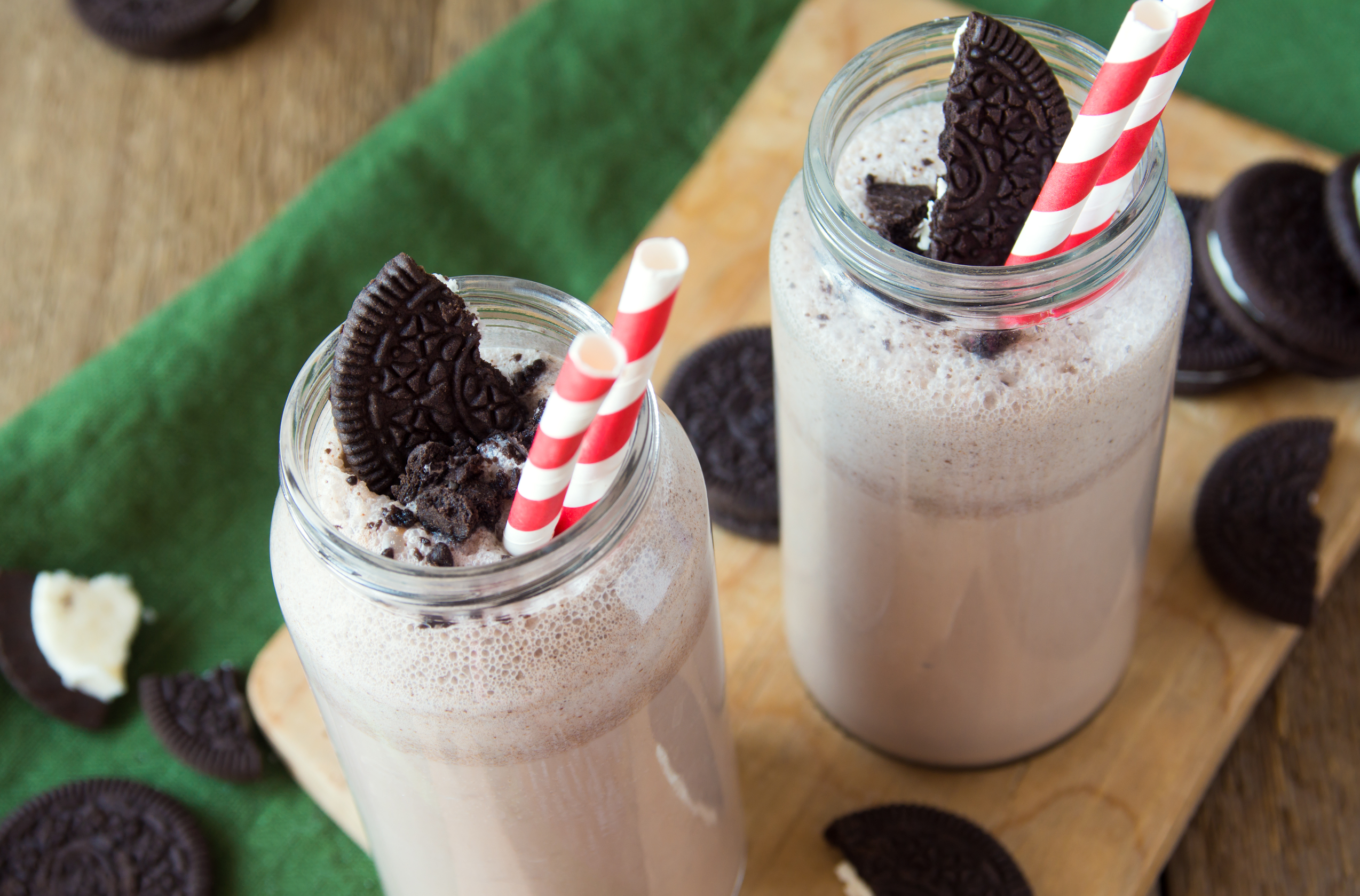 low-carb milk & cookies shake topped with cookies on a wooden board