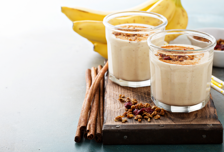 banana smoothie with almond butter and cinnamon in glasses