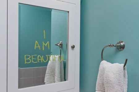 bathroom mirror written with "I am beautiful"