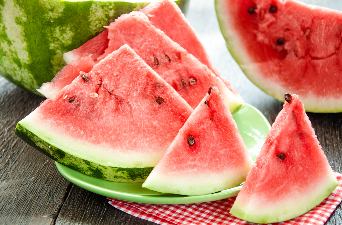 Ripe watermelons on table on wooden background