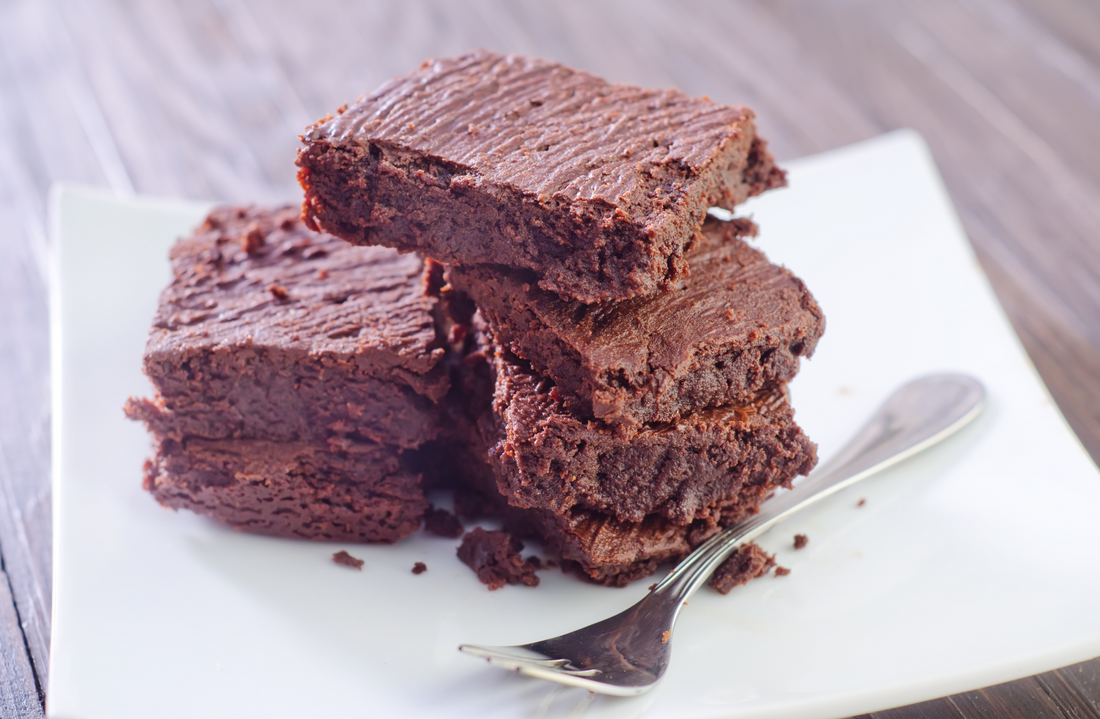 peanut butter brownies on a white plate and fork