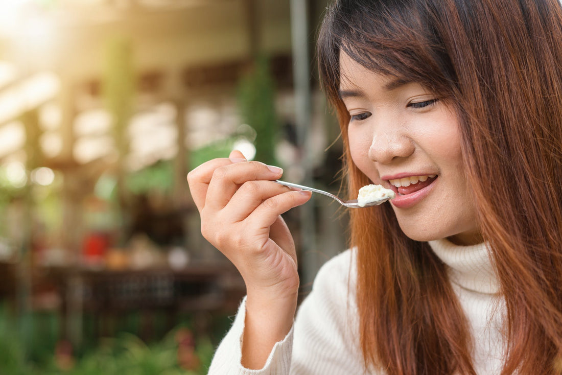 woman with a spoon near her mouth