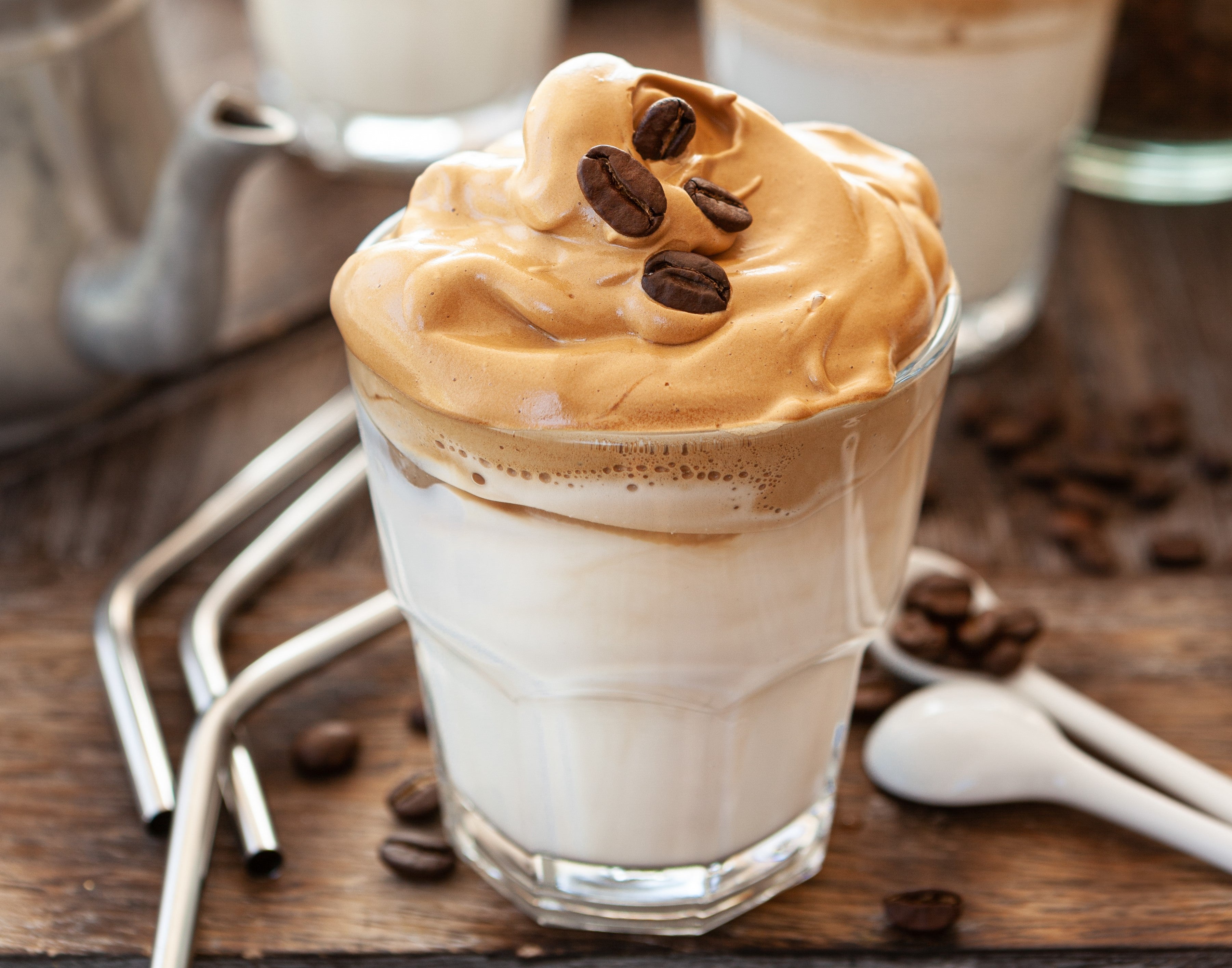 Whipped Coffee in a glass with coffee beans