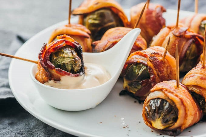 bacon-wrapped brussels sprout dipped in sauce