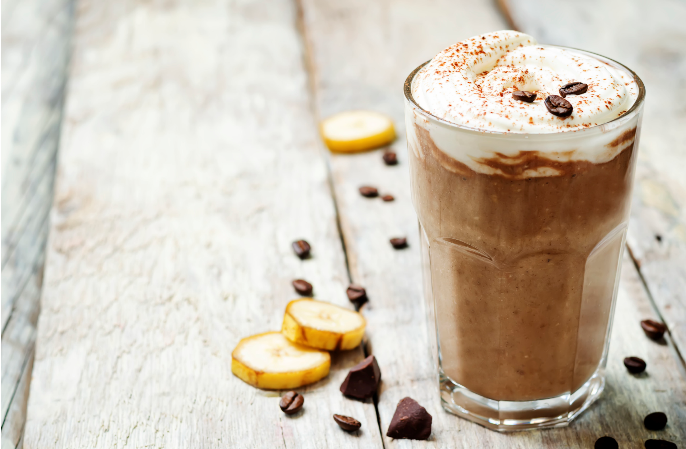 coffee chocolate banana smoothie with coconut whipped cream