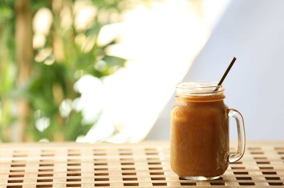 salted caramel shake in mason jar on wooden table