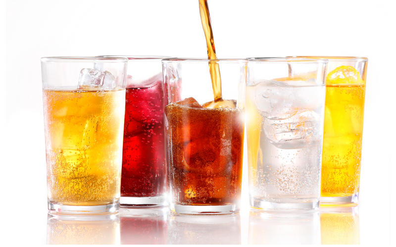 five glasses of different soda and drinks