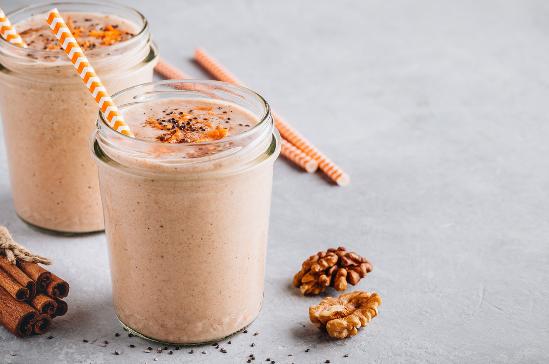 vanilla chai banana shake with walnuts and cinnamon sticks on the surface