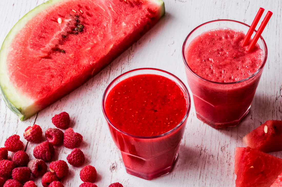 Two glasses of Watermelon Berry Slushee and a ripe watermelon