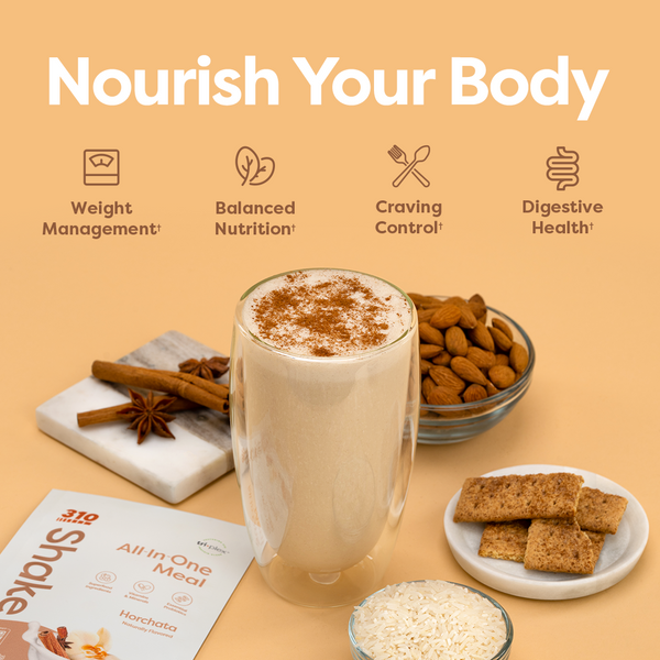 A glass of shake, surrounded by 310 Horchata, cinnamon sticks, almonds, granola and white rice.