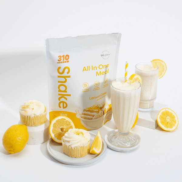  Lemon Cake pack surrounded with glasses of shake, cupcakes and lemons in a white background