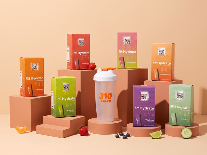 All six 310 Hydrate 15-count flavor boxes with fresh fruit