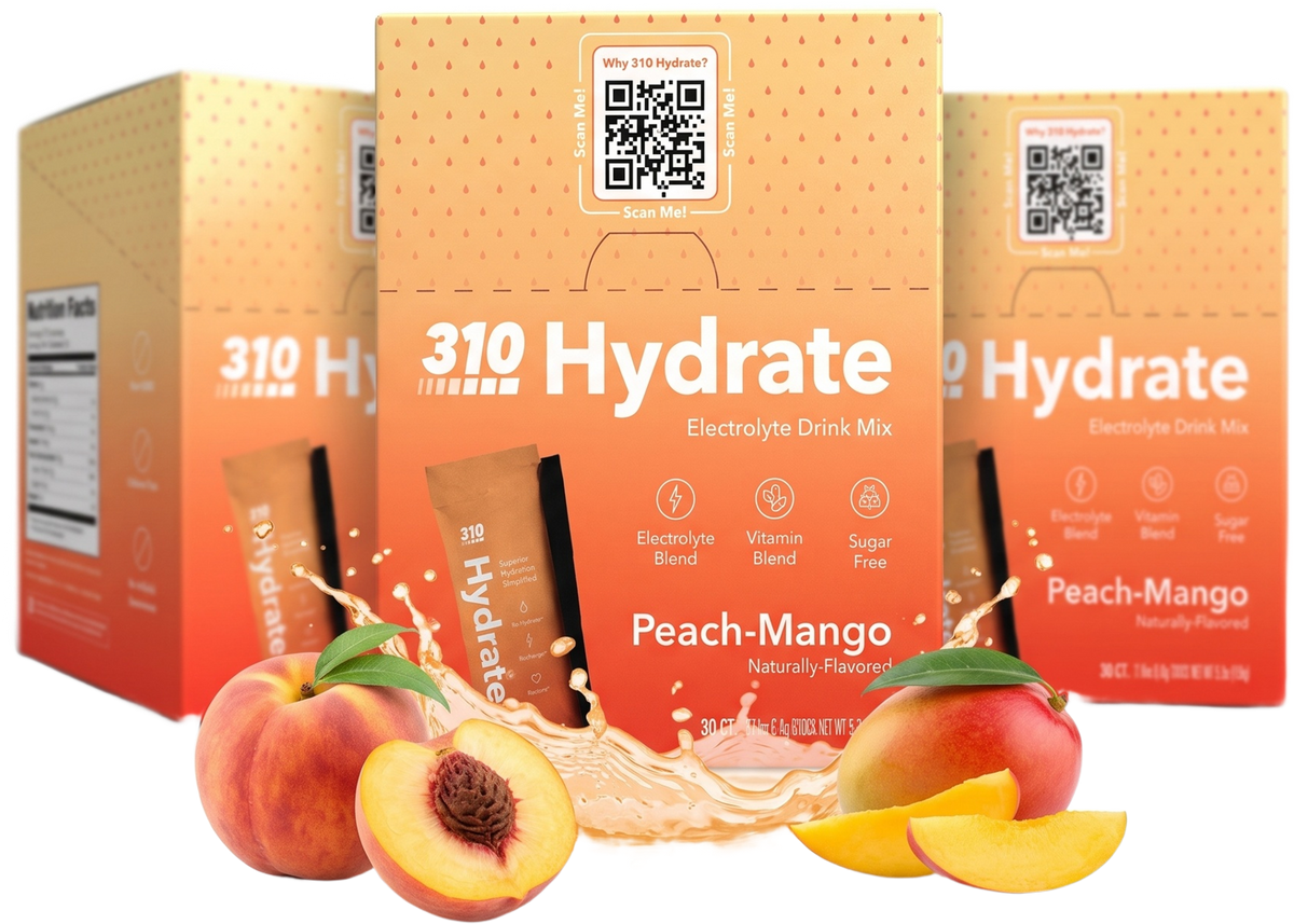 Three boxes of 310 Hydrate Peach Mango with fresh peaches, mango and a juice splash