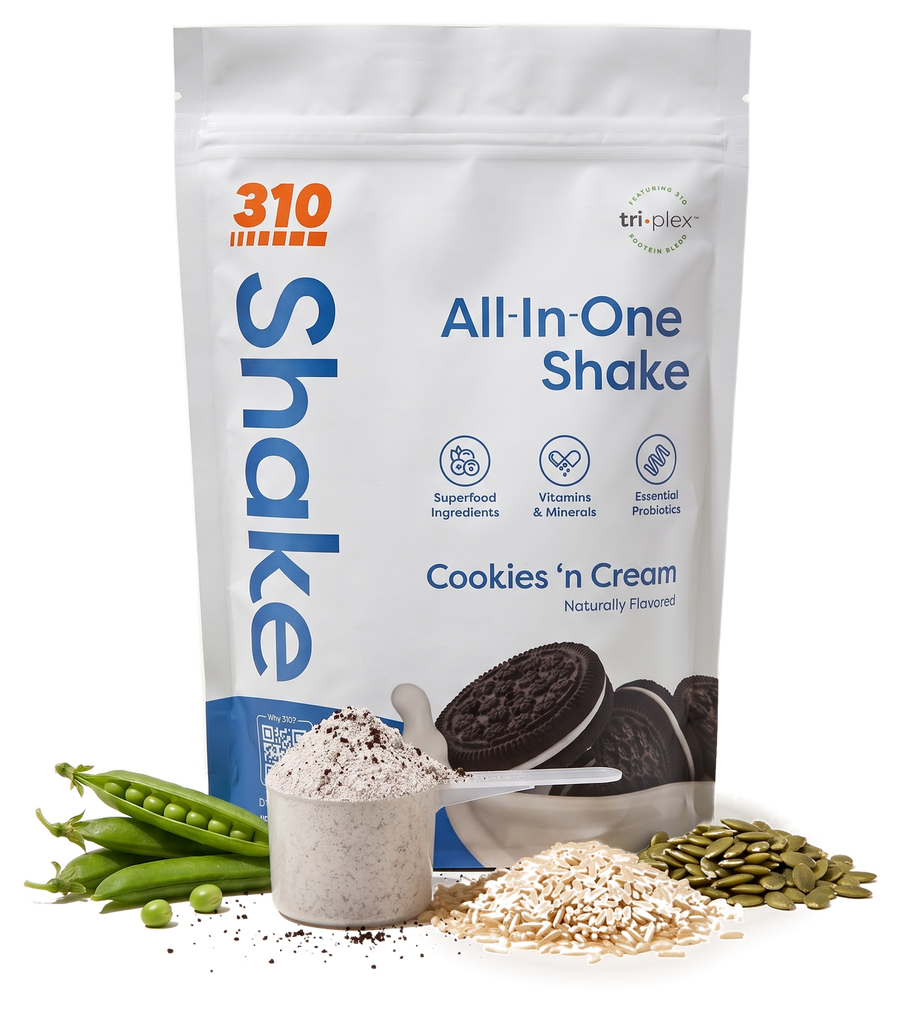 310 All-In-One Shake Cookies 'n Cream pouch with a scoop of powder, pea pods, brown rice and pumpkin seeds